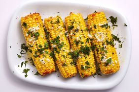 Mexican-Style Corn on the Cob on white serving plate