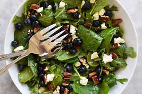 Summer Blueberry Salad With Toasted Pecans and Feta in a white serving bowl