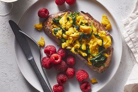 a photo of a plated Spinach & Egg Scramble with Raspberries