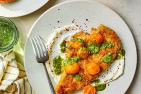 a recipe photo of the Crispy Breaded Pesto Chicken with Whipped Feta & Tomatoes