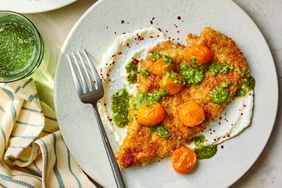 a recipe photo of the Crispy Breaded Pesto Chicken with Whipped Feta & Tomatoes