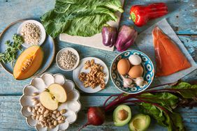 a group of Mediterranean Diet foods such as fruit, eggs, vegetables, seeds, and nuts