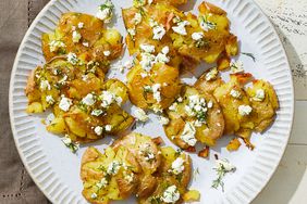 a recipe photo of the Crispy Smashed Potatoes with Feta and Dill served on a plate