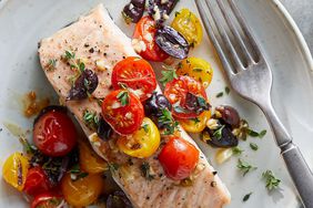 Salmon with Tomatoes and Olives recipe on a white plate