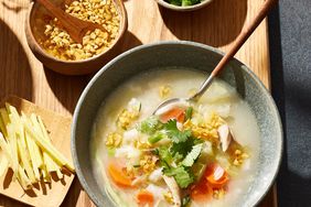 Overhead photo of a bowl of Thai-Style Chicken & Rice Soup with Fried Garlic Oil 
