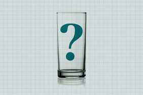 a photo of an empty drinking glass with a question mark in it 