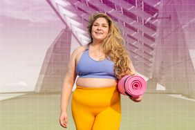 a photo of a woman in a sports bra and leggings walking with her yoga mat