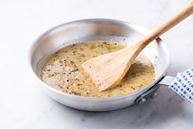 White wine lemon-caper sauce in a stainless steel pan